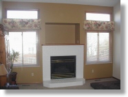 Painted living room and brick fireplace. Loveland, CO